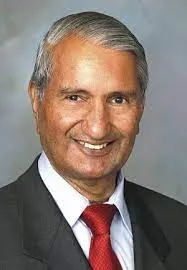 Dr. G.S. Khush at IRRI with rice varieties he developed